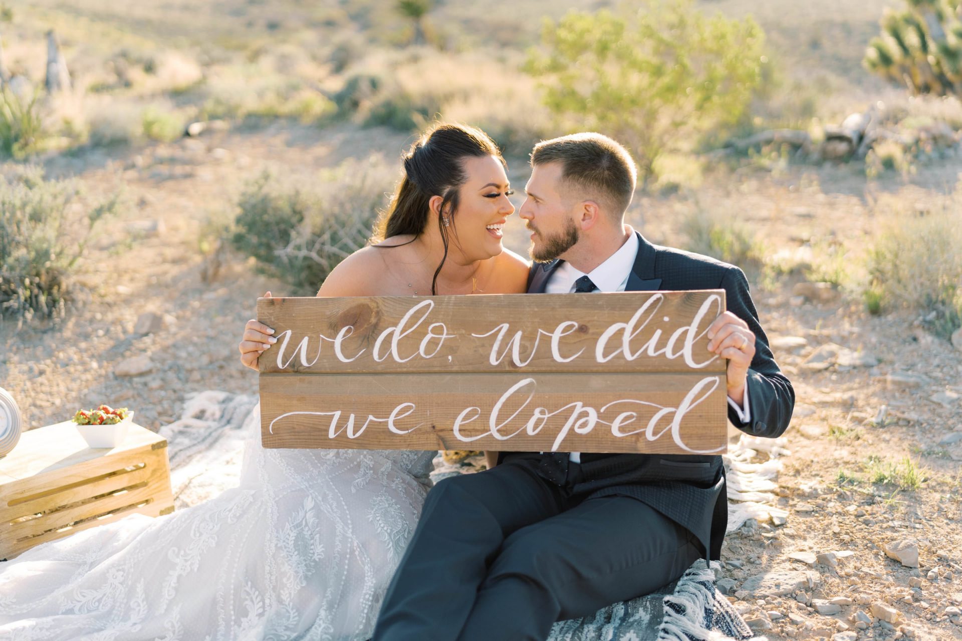couple with elopement sign