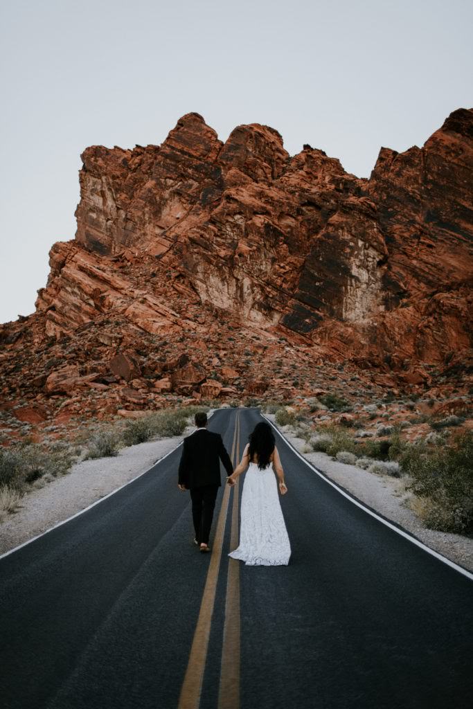 couple walking down road after eloping
