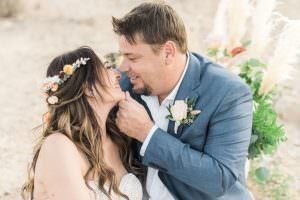 couple canoodling after elopement ceremony