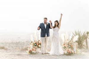couple taking wedding photos at red rock canyon