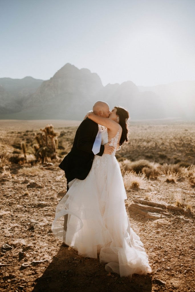 amazing elopement dress on couple kissing during wedding