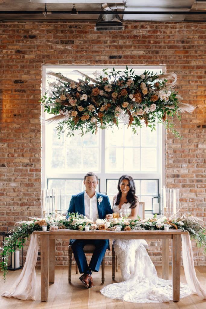 bride and groom at their wedding reception table