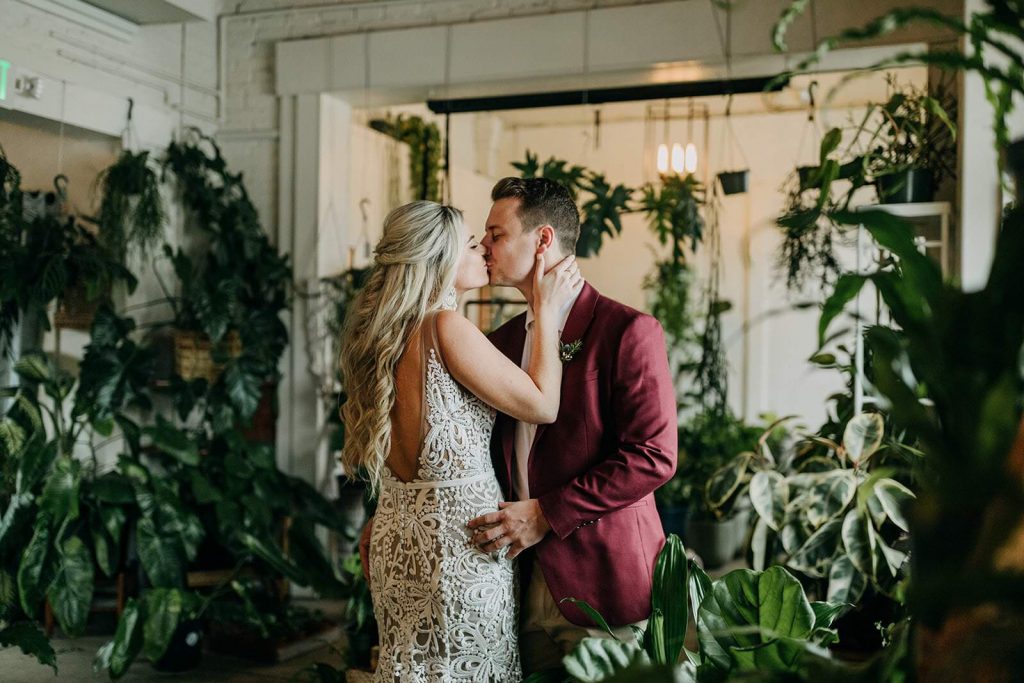 Couple kissing after wedding