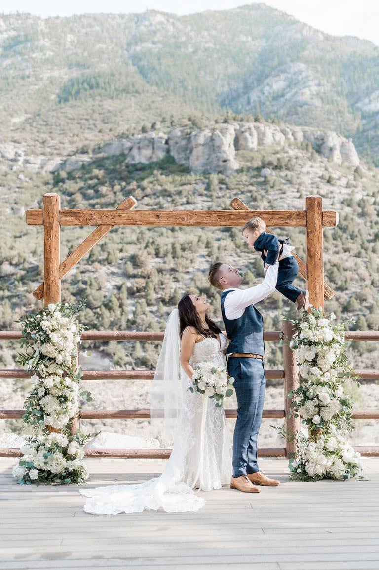 couple just married holding their child