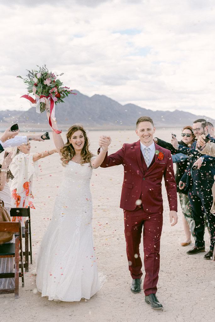 couple post elopement ceremony in desert