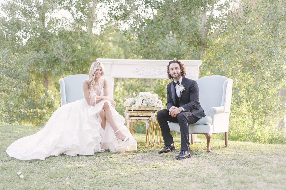 bride and groom sitting after wedding