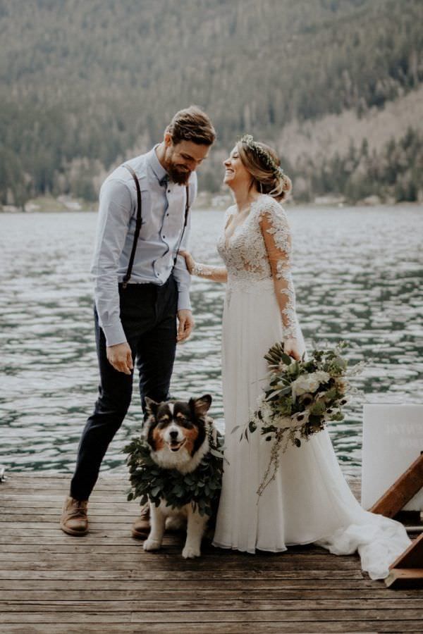 couple with their dog after wedding