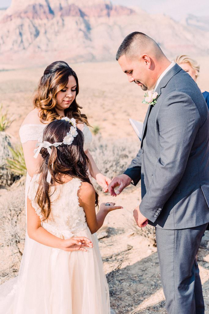 female-child-with-parents-at-wedding-ceremony