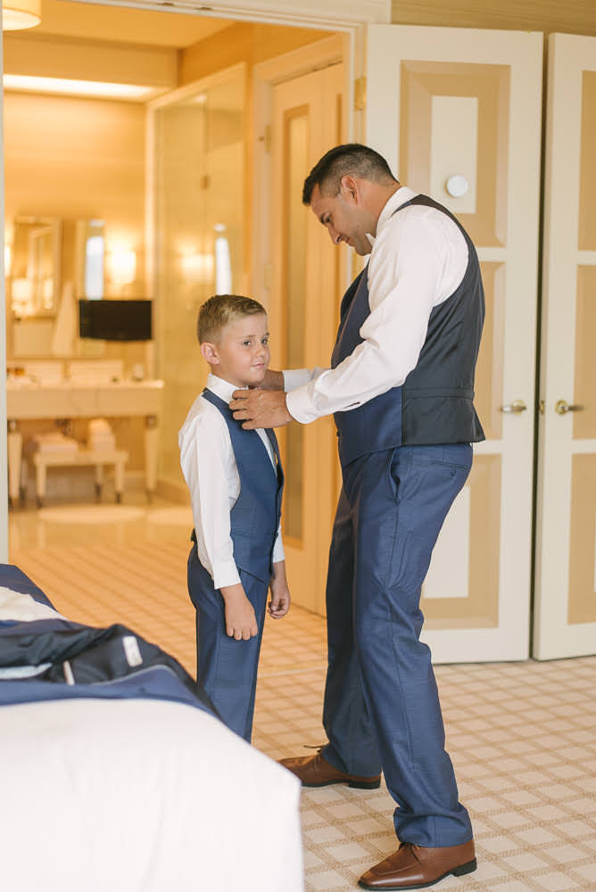 father and son (child) getting ready before wedding